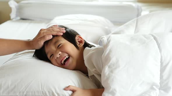 Cute Asian Child Sleeping On White Bed With Mother Care Slow Motion