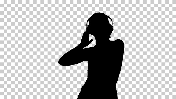 Silhouette Charming girl in shorts and earphones dancing