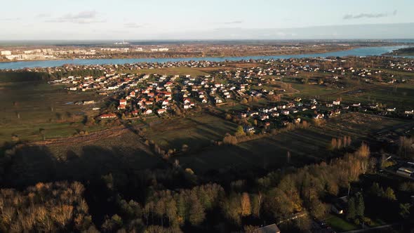 Aerial View of Small Modern Village Near River