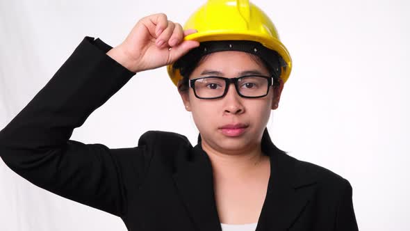 Woman technician smiling with helmet.