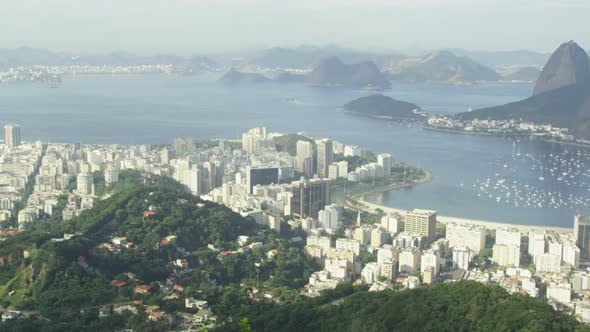 Pan of Rio and harbor from Corcovado lookout point