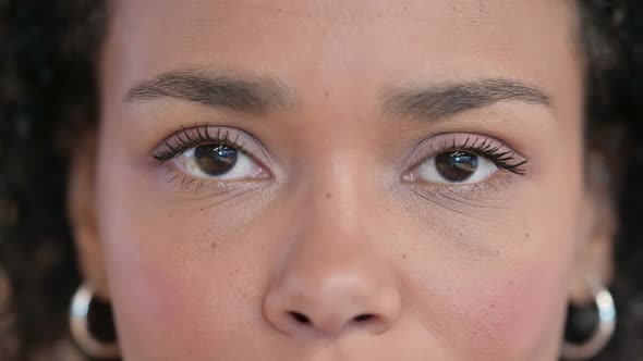 Close Up of Blinking Eyes of African Woman