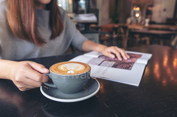 Closeup image of a beautiful asian woman reading magazine while drinking coffee in modern cafe / Photodune, Misc