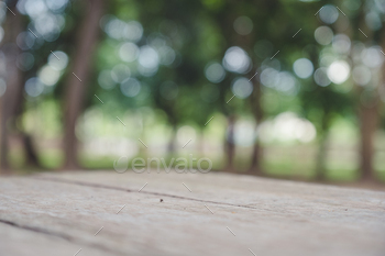 Closeup blur image of a wooden table with tree in background / Photodune, Misc