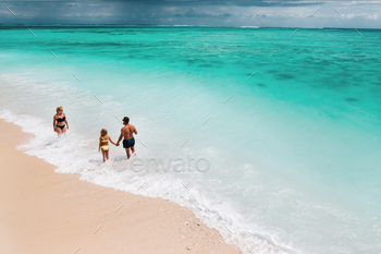 Young beautiful family with a child on a tropical vacation.mauritius island / Photodune, Misc