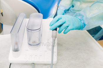Ultrasonic scaler in the dental office. Dentistry Concept / Photodune, Misc