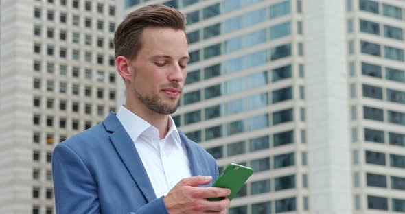 Caucasian Businessman Look at Mobile Phone in Hong Kong