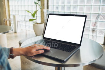 a woman using and touching on laptop computer touchpad with blank white desktop screen / Photodune, Misc