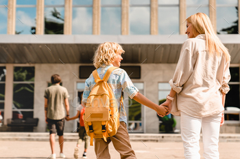 Parents going back to school with their children after summer holidays lockdown. / Photodune, Misc
