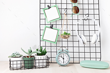Mockup of mesh board with blank cardsm sunglasses, earphones, house plants, alarm clock. Stay home / Photodune, Misc