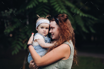 Picture of beautiful little baby goes for a walk in the park with her mother and she is interested / Photodune, Misc
