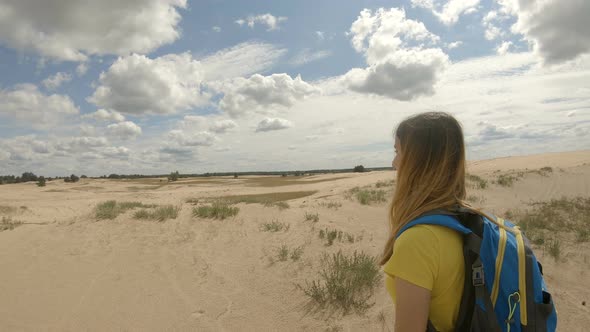 Young Girl Hiking in Dunes