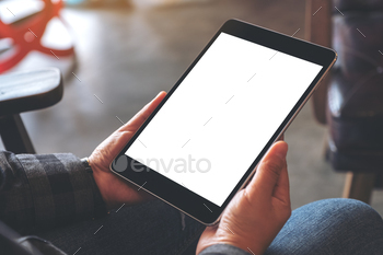 Mockup image of woman's hands holding black tablet pc with blank screen in cafe / Photodune, Misc