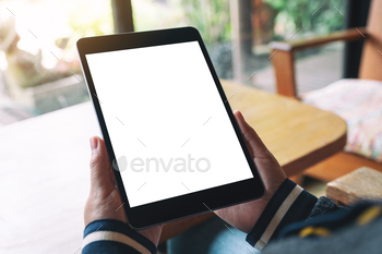 Mockup image of a woman holding black tablet pc with blank white desktop screen / Photodune, Misc
