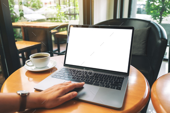 Mockup image of a woman using and touching laptop touchpad with blank white desktop screen / Photodune, Misc
