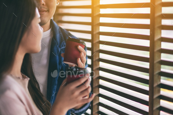 A man and a woman drinking coffee together / Photodune, Misc