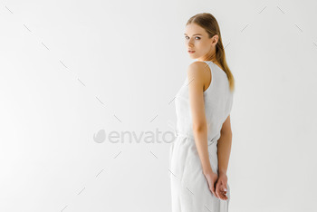 beautiful woman in linen white dress posing isolated on grey background / Photodune, Misc