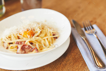 Hot Italian pasta served with yolk and cheese / Photodune, Misc