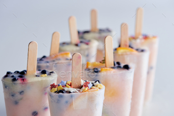 close-up view of fresh frozen homemade ice cream with organic fruits and berries on grey / Photodune, Misc