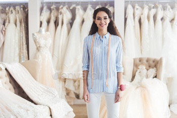Young female tailor standing in wedding atelier / Photodune, Misc