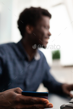 Customer holding debit credit card paying for purchases in web store / Photodune, Misc