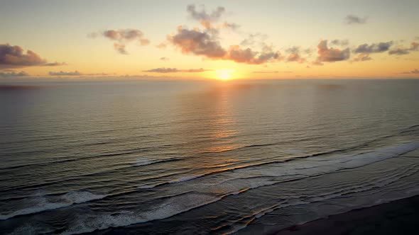 Beautiful Drone Shot Sunset Over Sea Ocean Waves Crashing on Beach