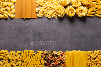 Raw pasta assortment at stone tabletop. Pasta collection food at table background / Photodune, Misc