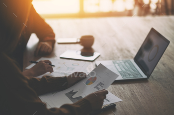 Three businessman working and discussing business together in a meeting / Photodune, Misc