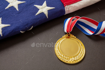 Medal gold for USA. Winner prize award with ribbon and US flag on black background. / Photodune, Misc