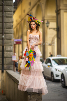 a bride in a pink wedding dress with an unusual bouquet and decoration in Gorova in Florence, Italy / Photodune, Misc