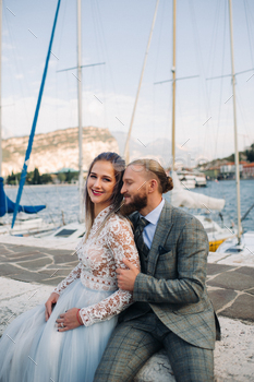Italy, Lake Garda. A beautiful couple on the shores of lake Garda in Italy at the foot of the Alps.A / Photodune, Misc
