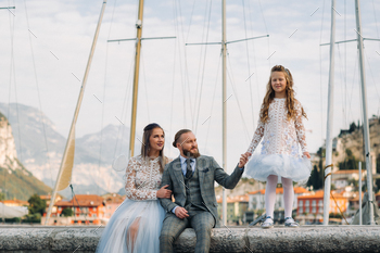 Italy, Lake Garda. Beautiful family on the shores of lake Garda in Italy at the foot of the Alps / Photodune, Misc