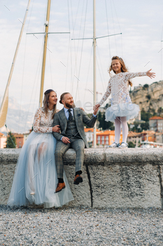 Italy, Lake Garda. Beautiful family on the shores of lake Garda in Italy at the foot of the Alps / Photodune, Misc