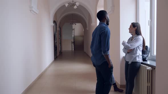 Three Students Talking and Saying Bye in College