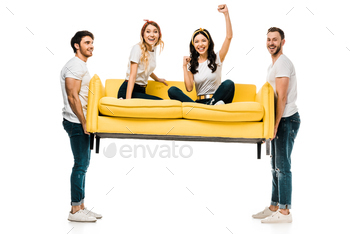 cheerful young men carrying couch with beautiful girls sitting on it isolated on white / Photodune, Misc