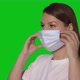Young Caucasian Beautiful Woman Put on Protective Face Mask - VideoHive Item for Sale