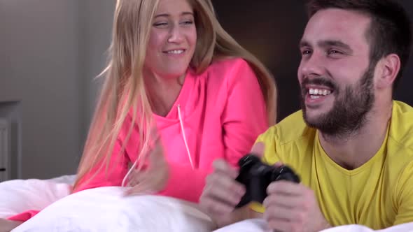 Young Couple in Bright Pajamas, Pillow Fight, Slowmotion