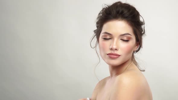 Sexy Woman with Evening Mua and Open Shoulders Looking To Camera