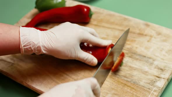 Chef Cut Bell Pepper On Wooden Board With Zucchini