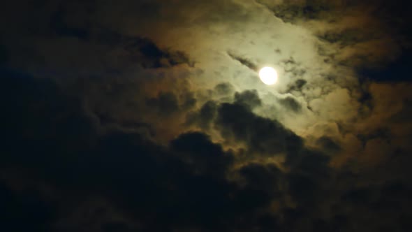 Timelapse of Full Moon Dark Dramatic Clouds in Night Sky Anamorphic Time Lapse