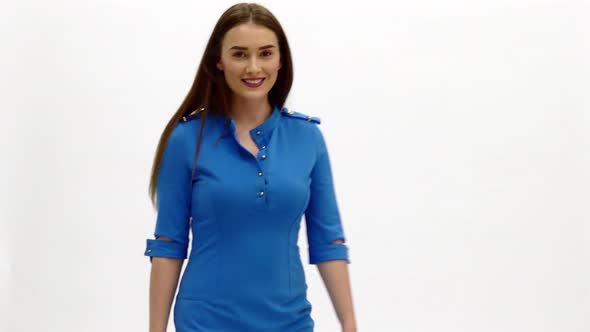 Air Hostess in Blue Uniform Welcomes Passengers on Board