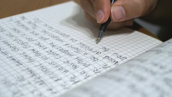 Hand of young women writing a notebook, doing homework, Concept of lifestyle and work at home.