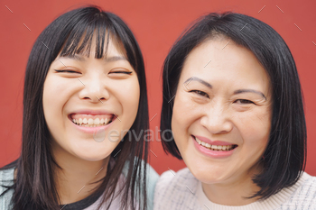 Happy Asian mother and daughter having fun outdoor / Photodune, Misc