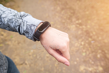 Fitness tracker on woman's wrist, sport activity monitor concept / Photodune, Misc