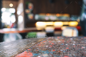Wooden table and chairs with blurred background in cafe / Photodune, Misc