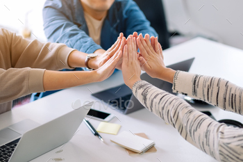 Group of businessman putting their hands together in the meeting / Photodune, Misc