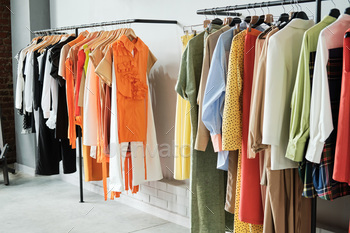 Fashion clothes hanging on the rack / Photodune, Misc