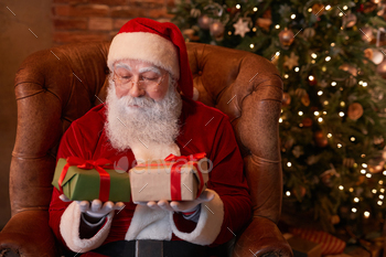 Santa Choosing Gift / Photodune, Misc