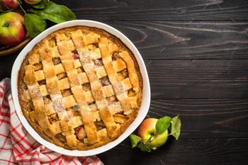 Apple pie with ginger and cinnamon at dark wooden table / Photodune, Misc