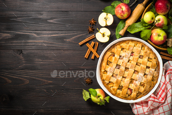 Apple pie with ginger and cinnamon at dark wooden table / Photodune, Misc